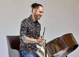 Victor Provost plays his oversized, Low G tenor pan. 